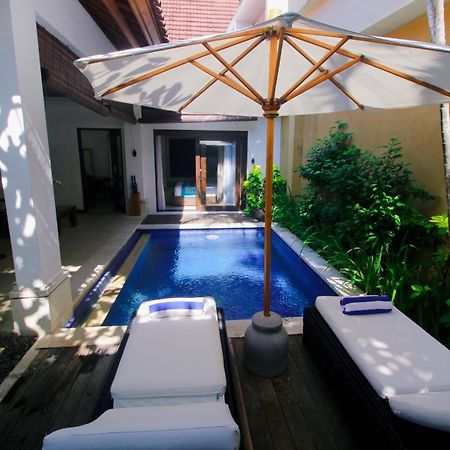 Sagara Villas And Suites Sanur By Ahm Buitenkant foto A pool at a resort in Phuket, Thailand