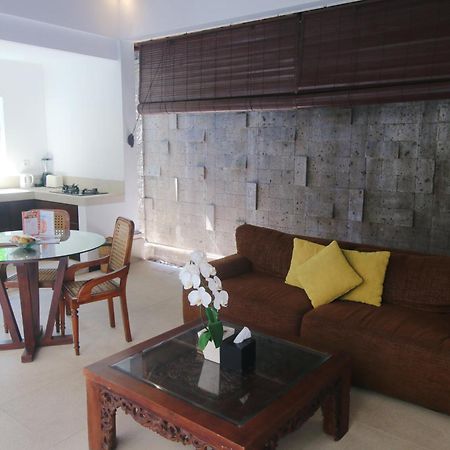 Sagara Villas And Suites Sanur By Ahm Buitenkant foto A living room in a villa