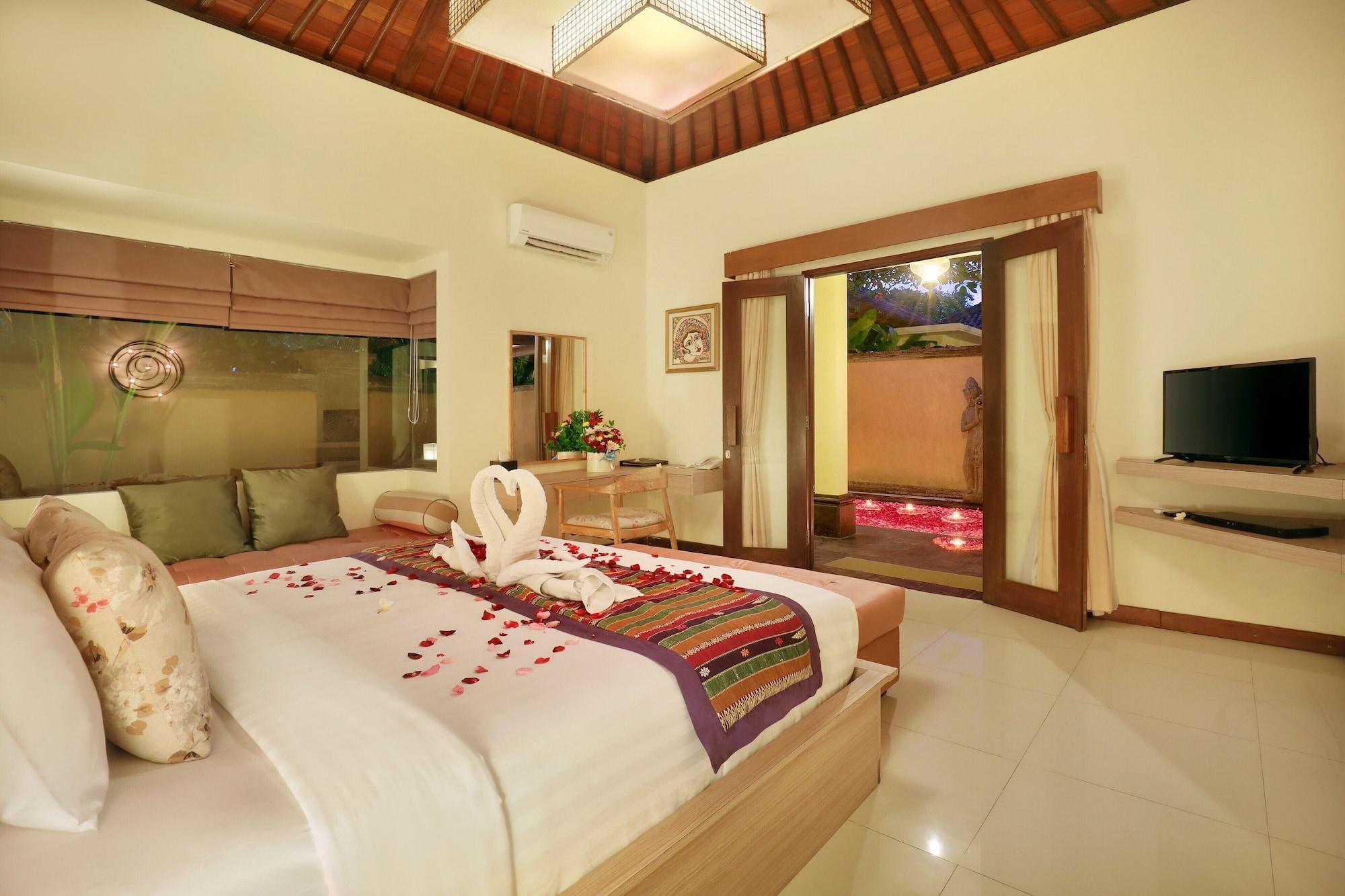 Sagara Villas And Suites Sanur By Ahm Buitenkant foto A bedroom at the resort