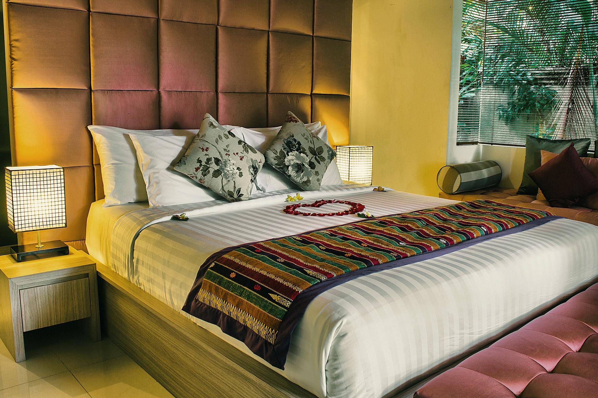Sagara Villas And Suites Sanur By Ahm Buitenkant foto A bed