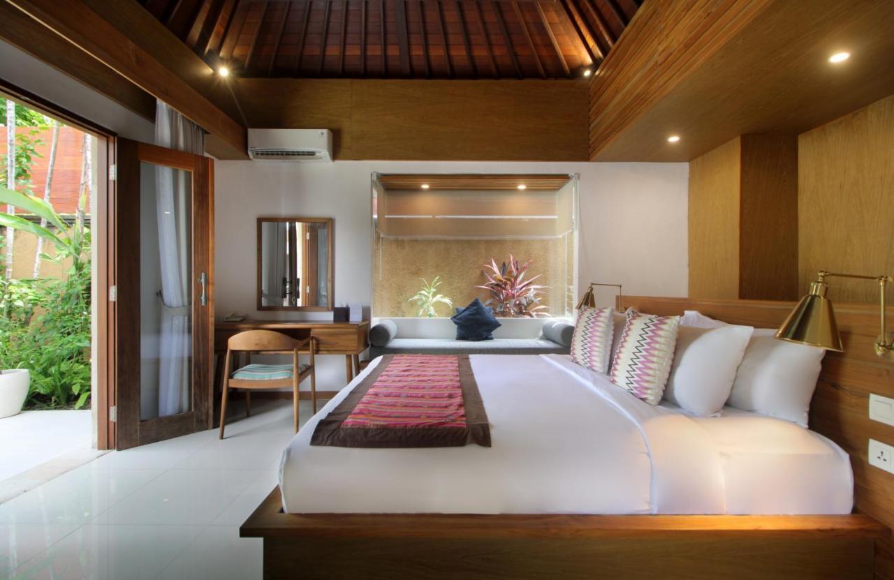 Sagara Villas And Suites Sanur By Ahm Buitenkant foto A bedroom at the resort