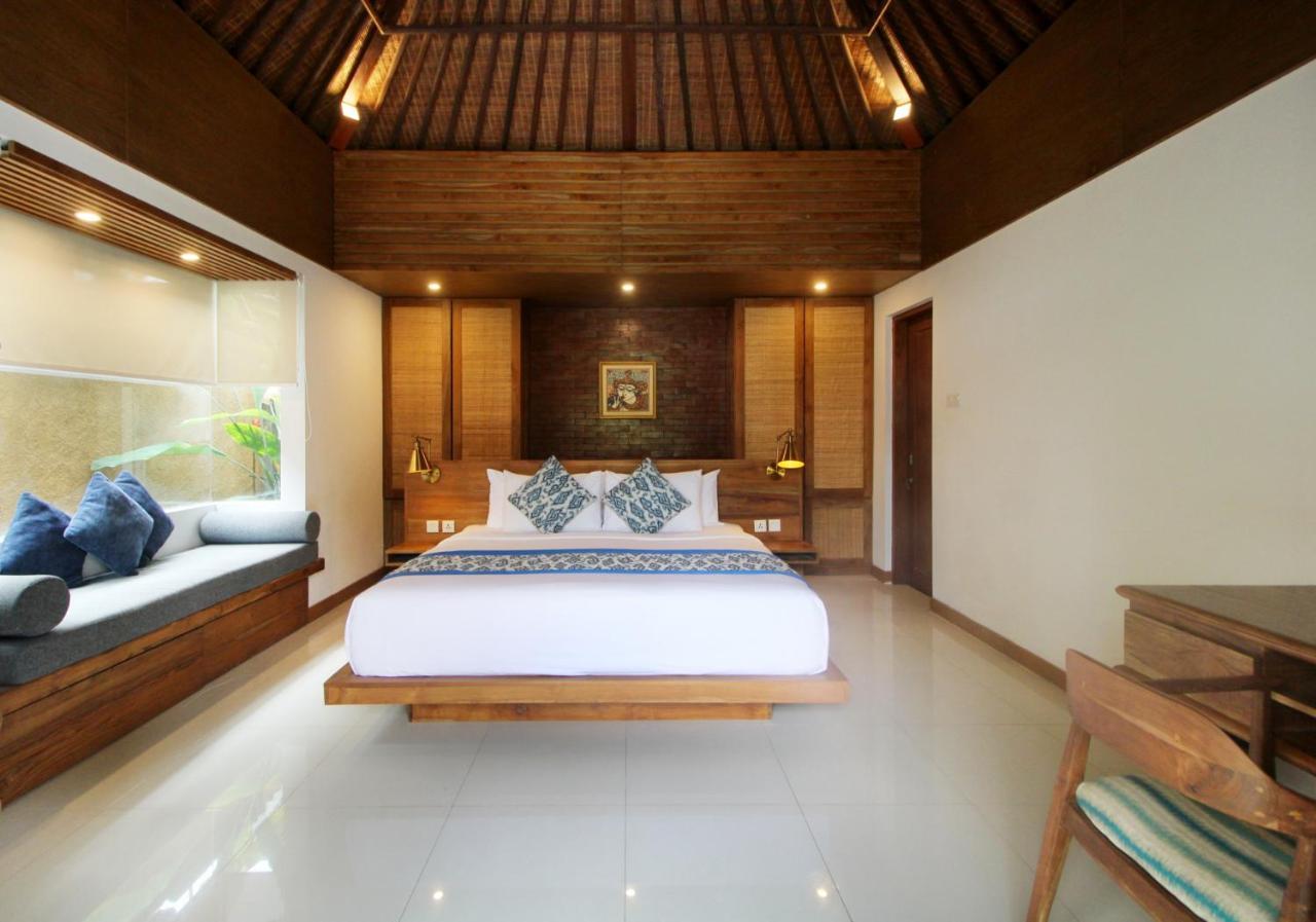 Sagara Villas And Suites Sanur By Ahm Buitenkant foto A bedroom in a villa