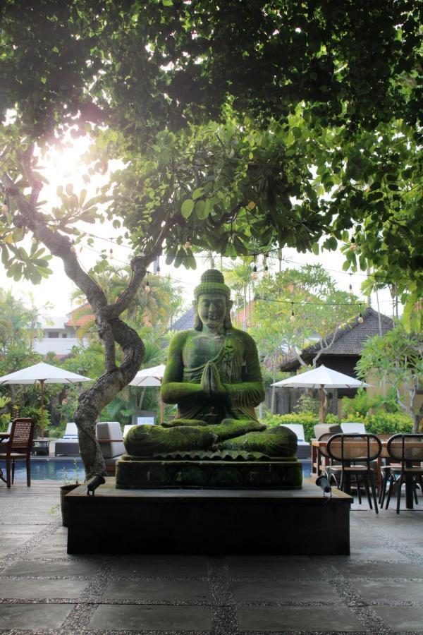 Sagara Villas And Suites Sanur By Ahm Buitenkant foto A statue of the Buddha in Bali