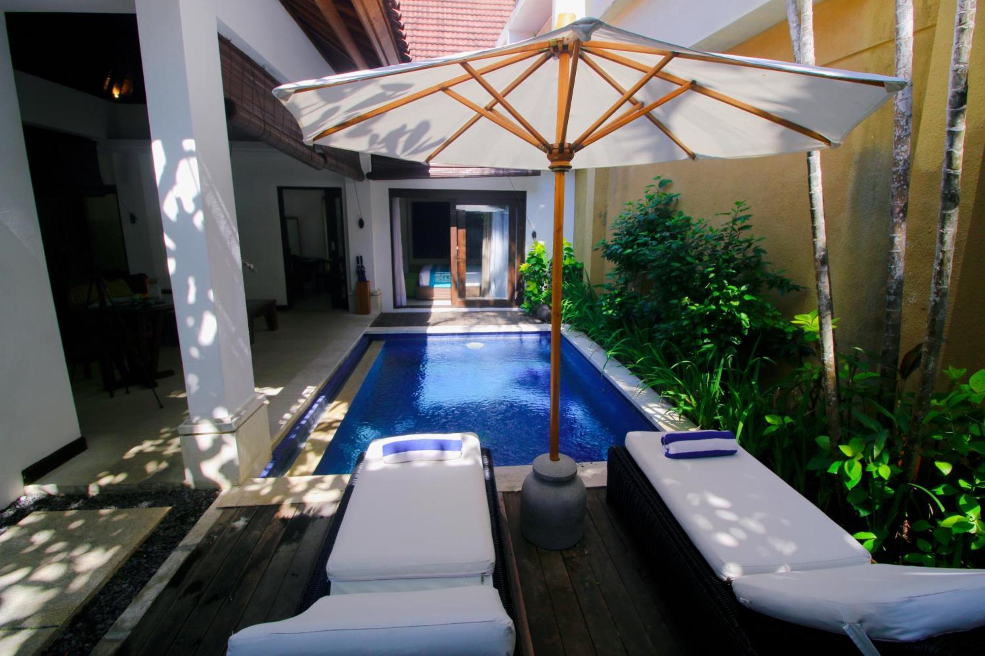 Sagara Villas And Suites Sanur By Ahm Buitenkant foto A pool at a resort in Phuket, Thailand